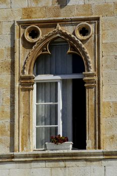 Ancient stone window in Hvar, Croatia