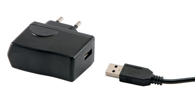 Mobile phone charger with 220v electricity connector and usb plug standart isolated on white background.