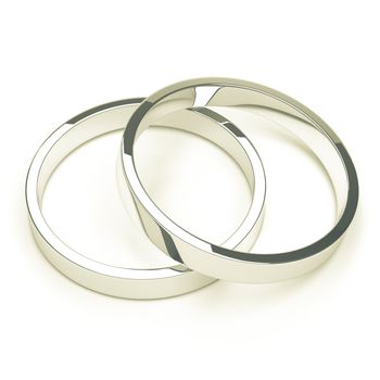 A pair of isolated silver or platinum weddings rings.