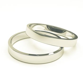 A pair of isolated silver or platinum weddings rings.