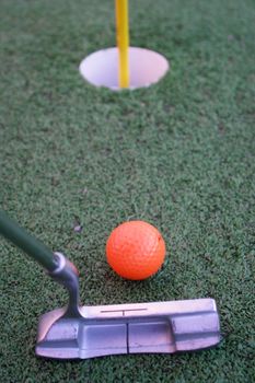 Close up of a pin and cup on a golf hole