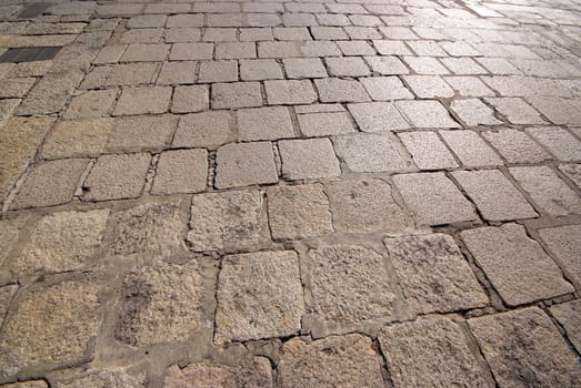 Old road paved with the cobble stones