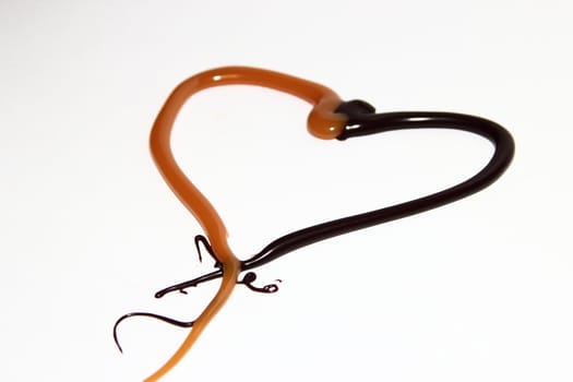 heart of caramel and chocolate on a white background as a symbol of love