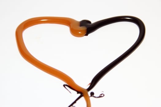 heart of caramel and chocolate on a white background as a symbol of love