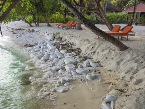 Beach erosion attempt at prevention by sandbagging