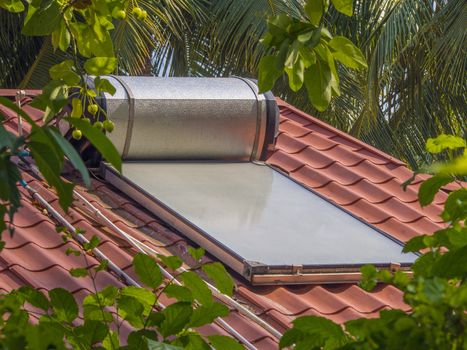 Solar water heater sits on the roof of a home in the Maldive islands