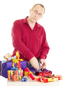 Person packaging some colorful gifts