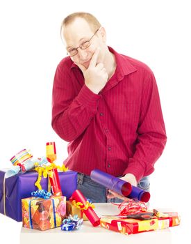 Person packaging some colorful gifts