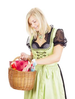 Young woman carries a basket with gifts