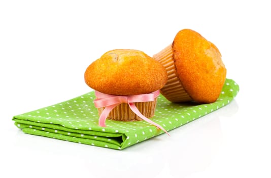 muffins on green serviette,  isolated on white background.