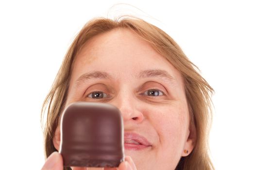 Woman with chocolate marshmallow in the face