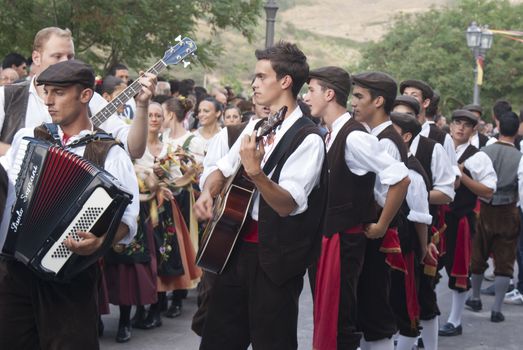 POLIZZI GENEROSA, SICILY-AUGUST 19: Sicilian folk group at the "Festival of hazelnuts" music and parade through the city on August 19, 2012 in Polizzi Generosa, Sicily, Italy