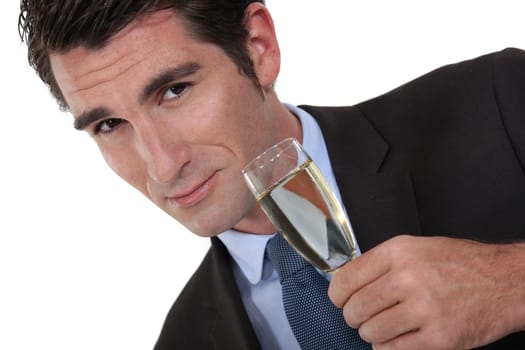A businessman drinking champagne.