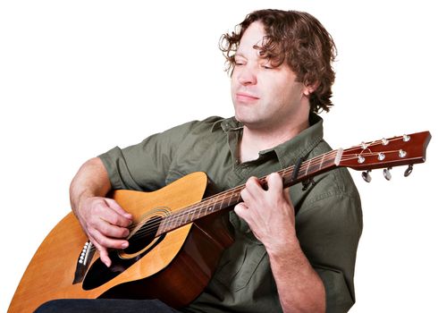 Serious man with eyes closed playing a guitar