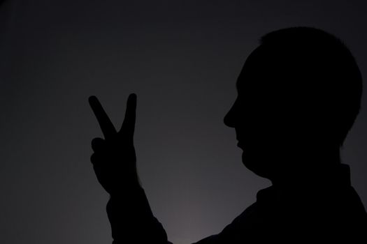 Man showing V sign