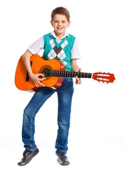 Cute boy with classical guitar. Isolated on white background