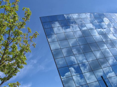 Small futuristic public building at springtime.