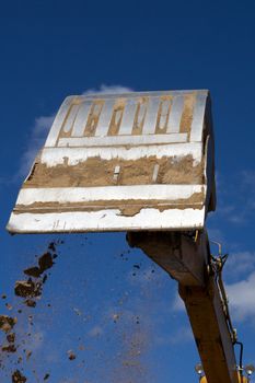 excavator bucket against the blue sky
