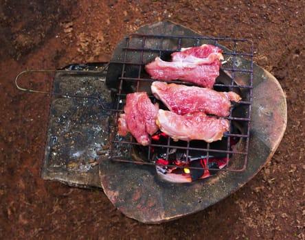 Traditional charcoal-grilled meat on the ground