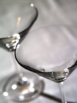 Photo of two abstract martini glasses with a very shallow depth of field.