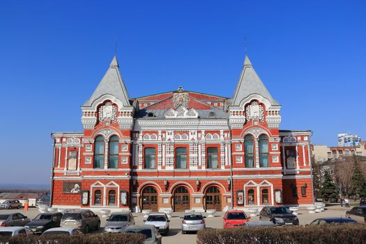 Town landscape with historic theater and blue sky
