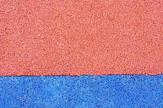 Texture of color rubber floor on playground. ( Ethylene Propylene Diene Monomeror EPDM)