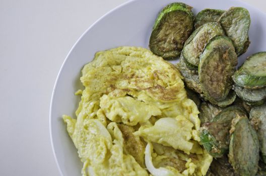 Omelet with fried eggplants vegetables