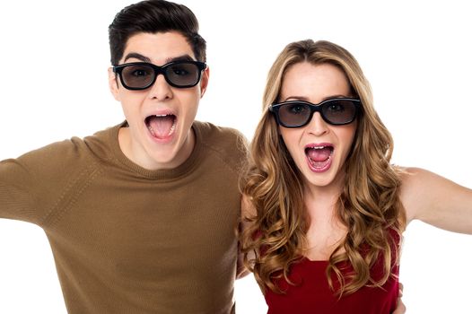Young couple in shades screaming in excitement, great bonding.