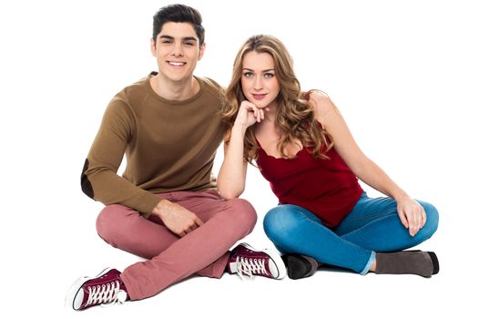 Romantic trendy couple posing together isolated over white background.