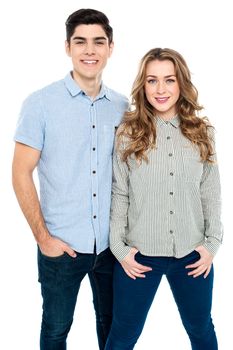 Love couple in trendy outfit striking a stylish pose.