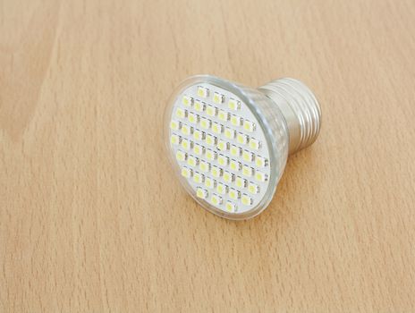 LED bulb on wooden background