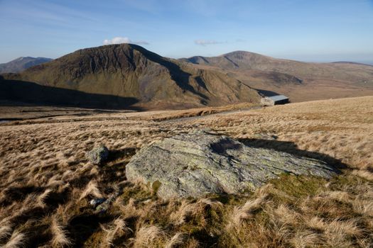 A view at sunrise  towards Moel Cynghorion and Eilio in the Snowdonia nation park, Gwynedd, Wales, UK.