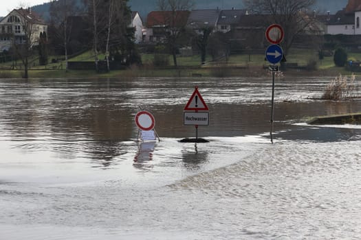 STADTPROZELTEN, BAVARIA/GERMANY - DEC 2012: Flooding of the Main. Stadtprozelten suffers regular flooding of Main. Flood warnings are erected to warn the population.