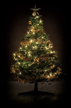 Decorated christmas tree with yellow and green balls