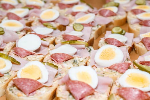 Detail of homemade sandwich with egg and sausage