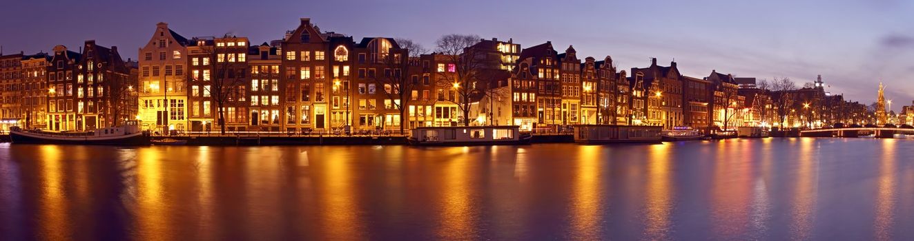 Panorama from Amsterdam with the Munt tower in the Netherlands at twilight