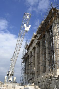 The Pantheon on the Acropolis of Athens under construction. The weather is fine but dark clouds loom in the distance.