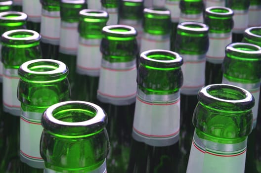 An array of green beer bottles.