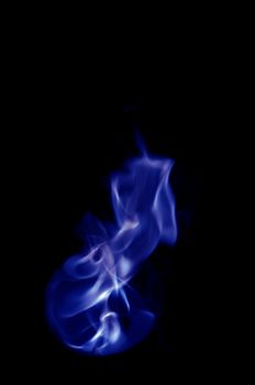 blue fire with a black background, abstract background.