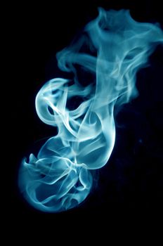 bluish fire with a black background, abstract background.