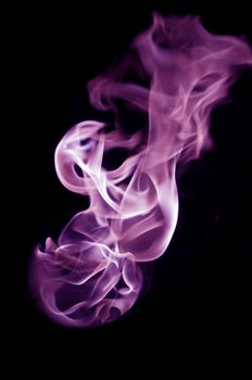 purple fire with a black background, abstract background.