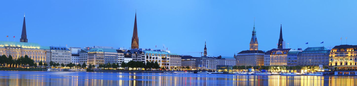 Panorama picture of the Binnenalster in Hamburg at the blue hour.