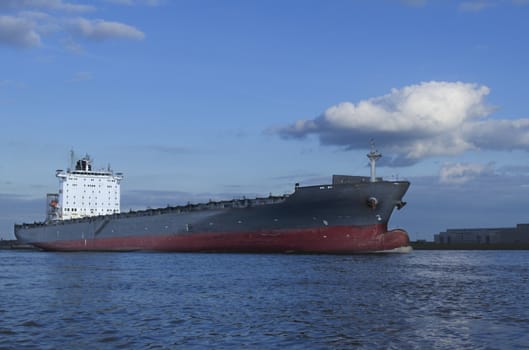 An empty container vessel leaving the harbor of Hamburg.