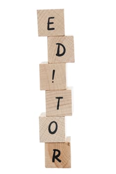 Editor spelt out using wooden blocks with exclamation mark.