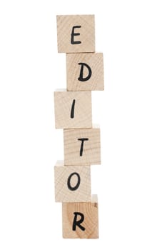 Editor spelt out using wooden blocks on white background.