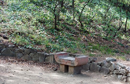 Spring time: stone bench in the garden