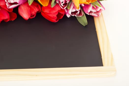 Bunch of tulips with blackboard