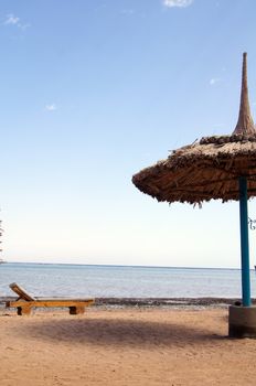 Sun beds and umbrella on the beach