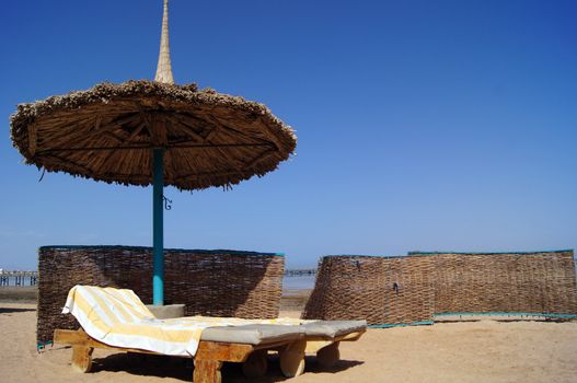 Sun beds and umbrella on the beach