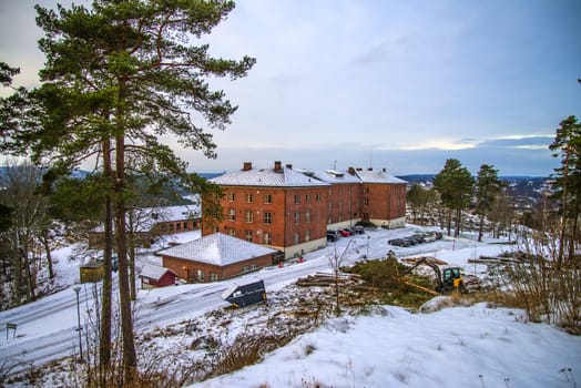 construction of the new barracks was begun in 1939, in 1940 completed the germans after having ingested the fortress, after the war, the large brick building was used as a barracks for students of military education, today is the building used as a hotel and conference rooms, picture is shot in december and shows the north side of the facades